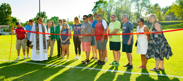 Ribbon cutting at Father Frey Athletic field in September 2021.